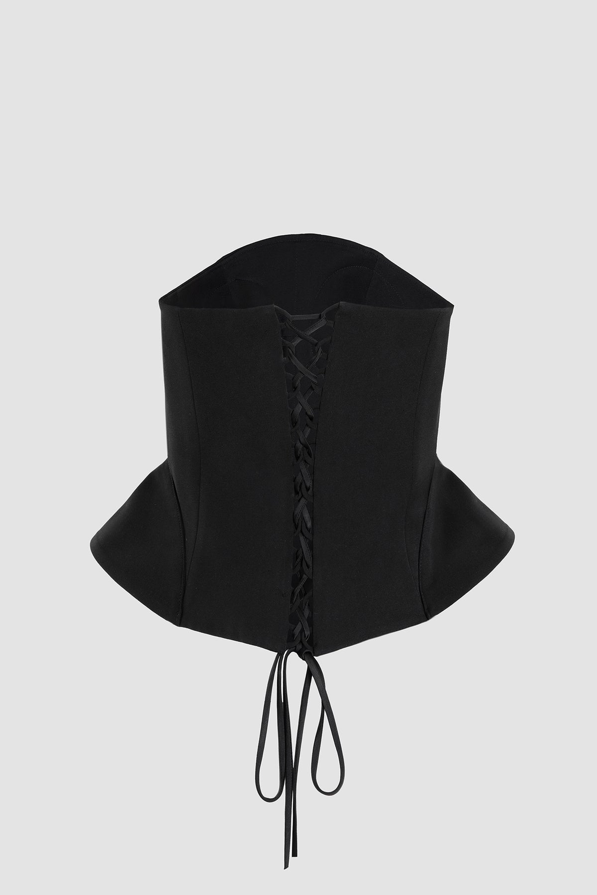 Ningyo Bustier in black crepe with hand-cast brass fish brooch, by WTYO
